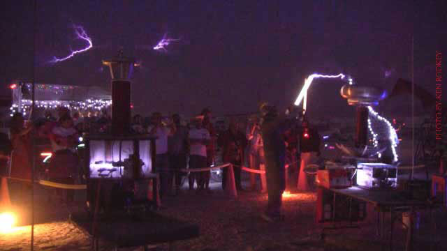 Kilovolt with florescent tube and Tesla Coil Burning Man 2012